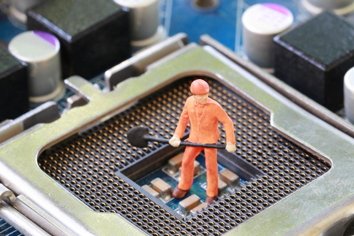 A close-up of a miner inspecting a mining rig at a large scale mining farm.